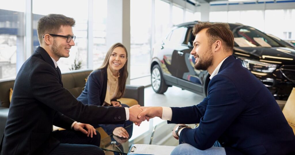 man purchasing used car