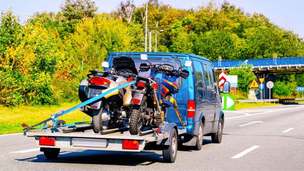 Motorcycle secured on a trailer showing how to transport a motorcycle safely in 2025